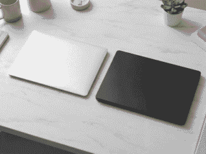 M4 MacBook Air vs M5 MacBook Pro comparison side by side on desk